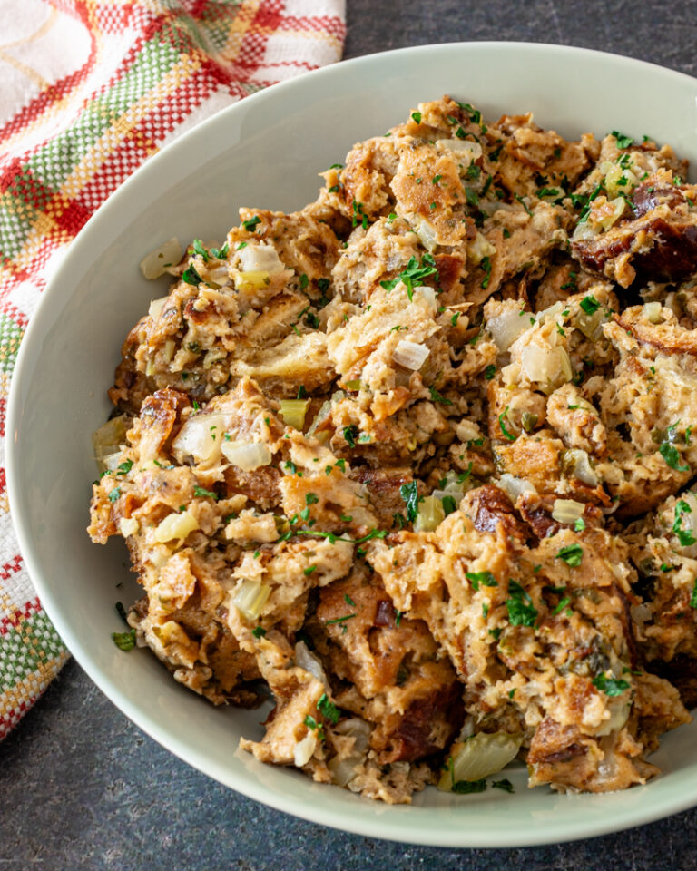 Instant Pot stuffing in a green serving bowl, cooked and ready to enjoy.