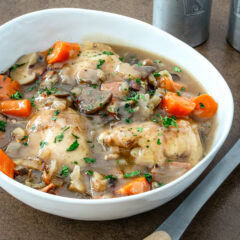 White wine braised chicken thighs cooked in the Instant Pot pressure cooker.