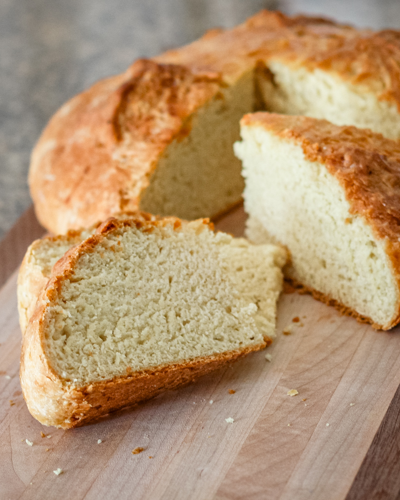 Sliced Irish soda bread on a cutting board.