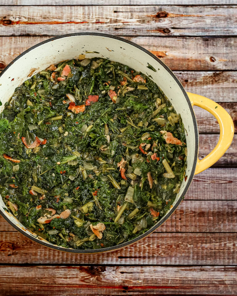 dutch oven with a mess of kale and mustard greens with bacon