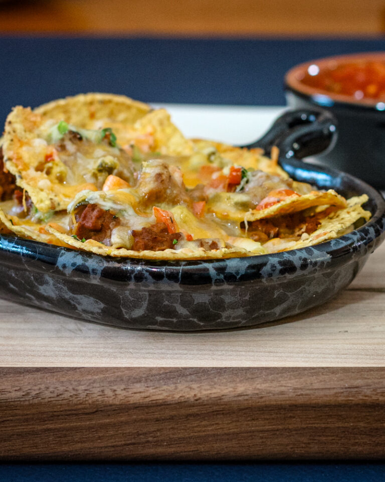 loaded nachos in a luncheon plate