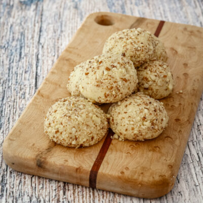 macadamia nut cookies on a small cutting board
