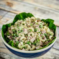macaroni salad with ham in a serving bowl
