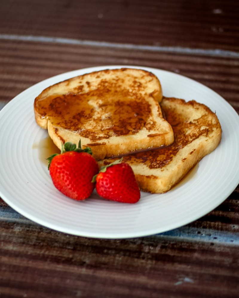 maple cinnamon french toast on a plate with strawberries