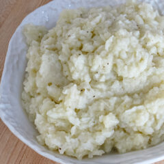 A serving bowl of mashed cauliflower