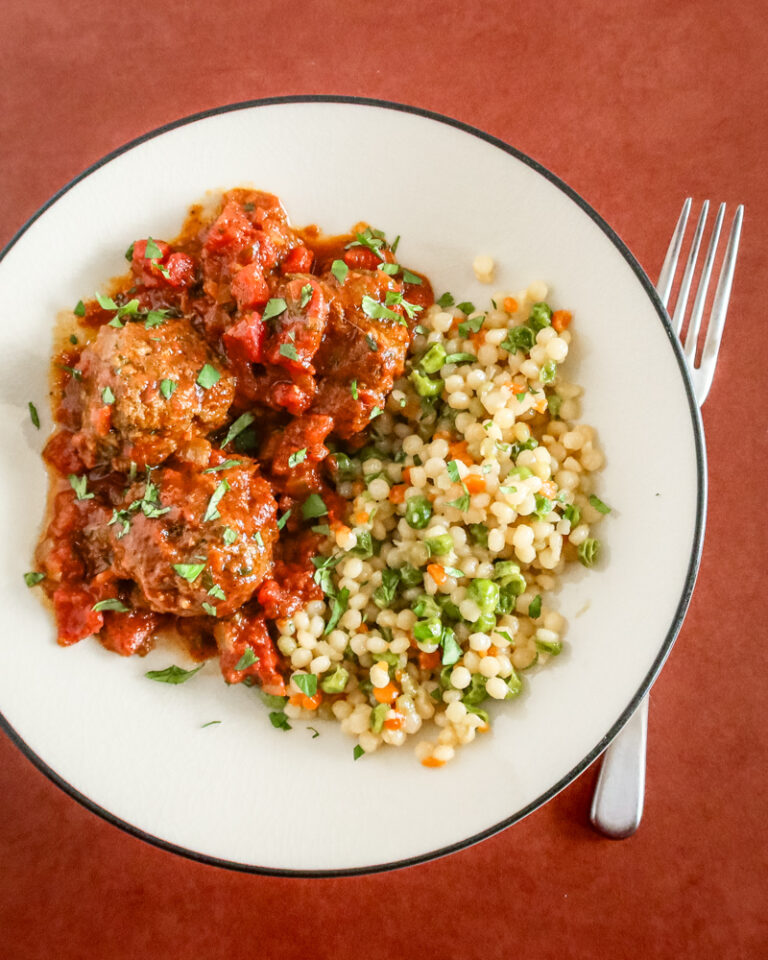 moroccan meatballs on a plate with couscous