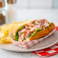 An authentic New England lobster roll in a New England hot dog roll.