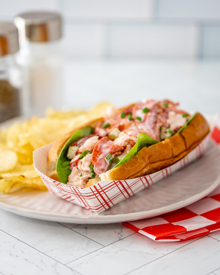 An authentic New England lobster roll in a New England hot dog roll.