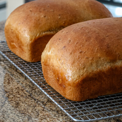 Loaves of oatmeal molasses bread.