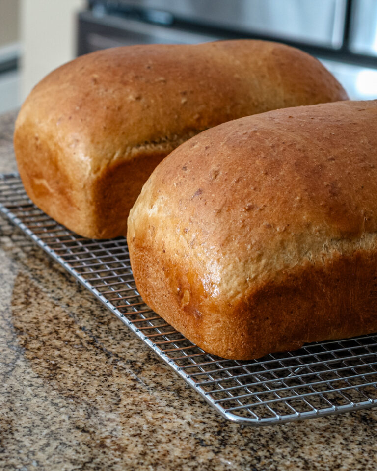 Loaves of oatmeal molasses bread.