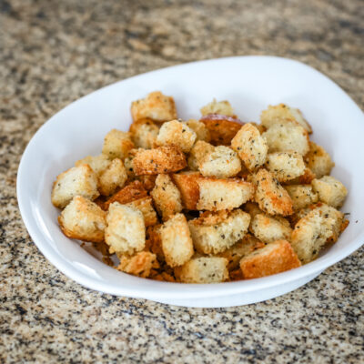 Seasoned croutons in a small bowl.