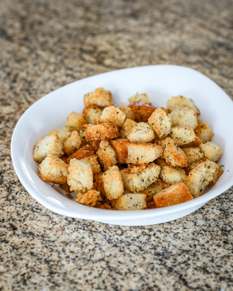 Seasoned croutons in a small bowl.