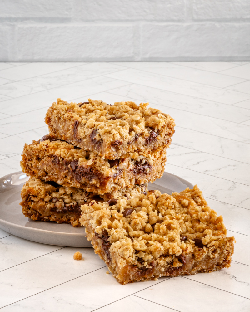 A stack of chewy peanut butter chocolate chip oat bars.