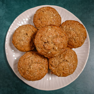 Pear muffins on a plate with more in the background