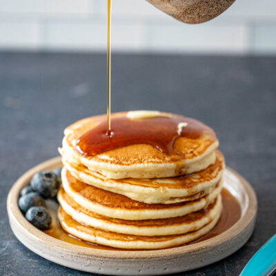 pancakes on a plate with maple syrup