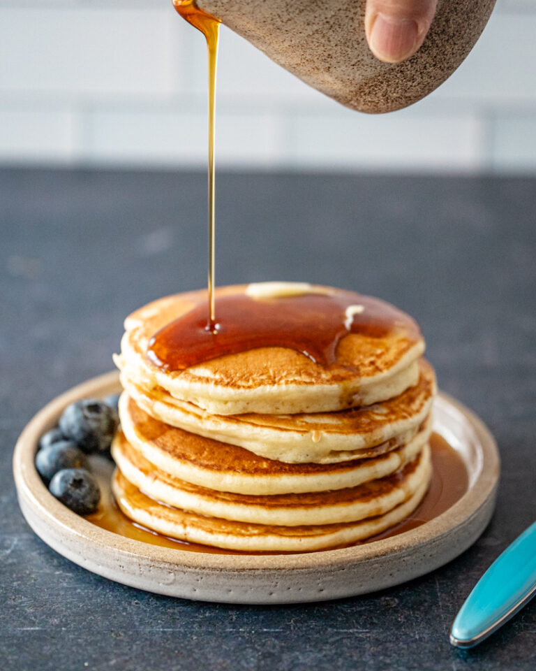 pancakes on a plate with maple syrup