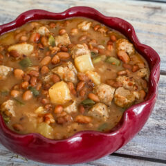 slow cooker pineapple beans with sausage in a serving dish