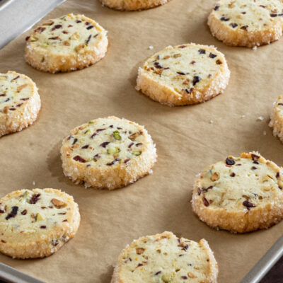 A stack of pistachio cranberry shortbread cookies