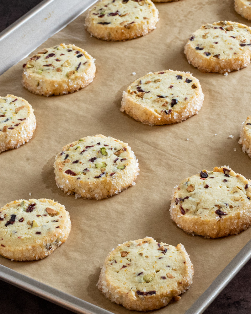 A stack of pistachio cranberry shortbread cookies