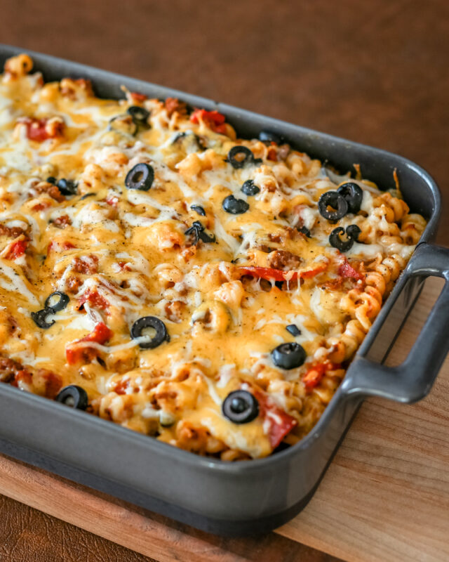 Baked pizza casserole on a cutting board