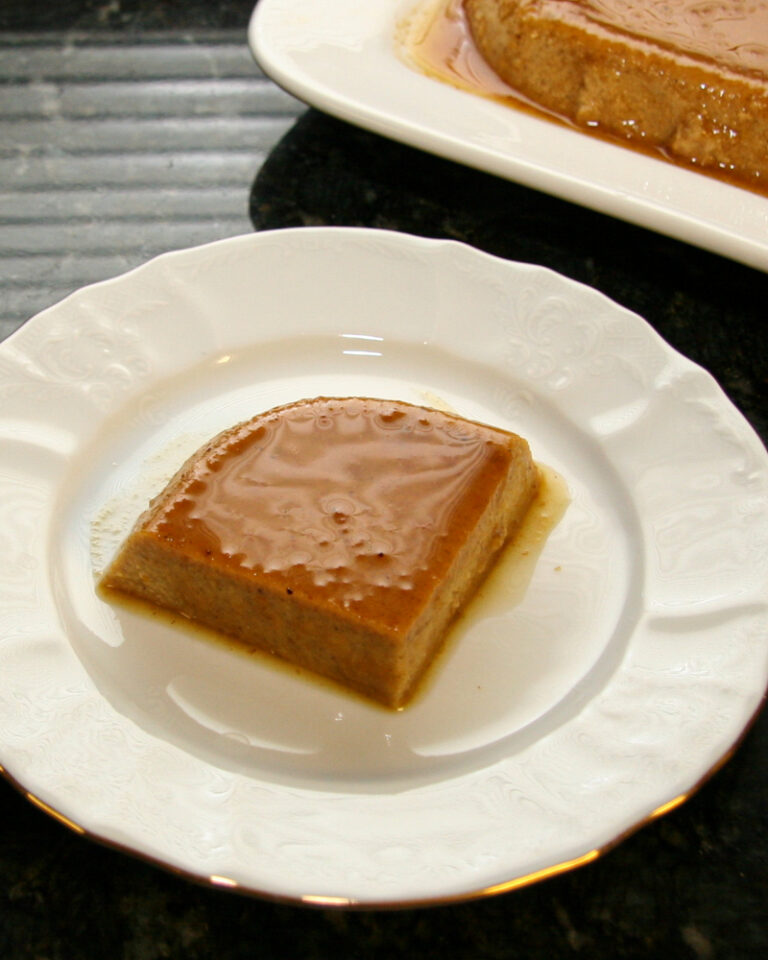 A slice of pumpkin flan on a dessert plate