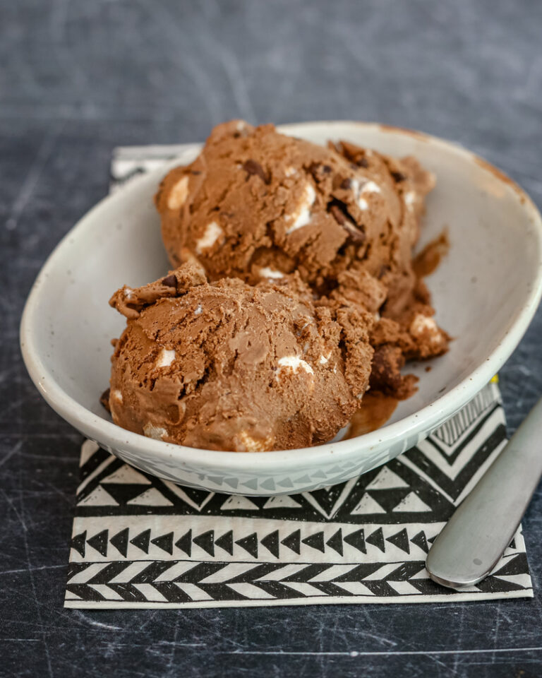 scoops of rocky road ice cream in a dessert dish