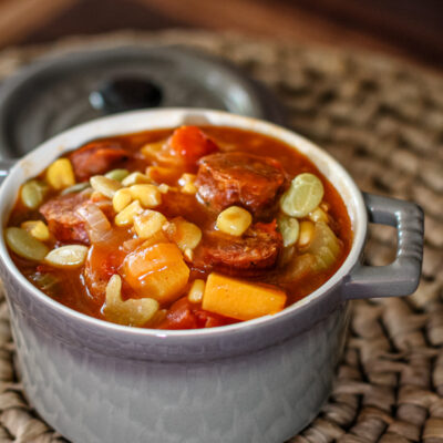 A colorful butternut squash stew with sausage.