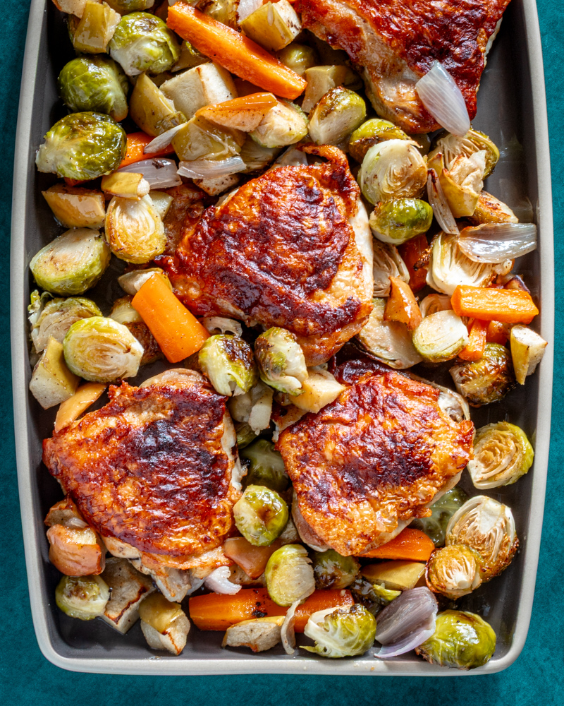 Roasted chicken thighs with roasted Brussels sprouts and carrots.