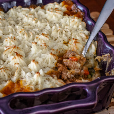 shepherd's pie with lamb and potatoes in a baking dish