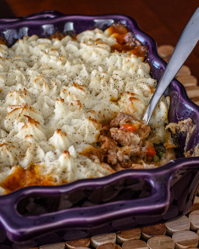 shepherd's pie with lamb and potatoes in a baking dish