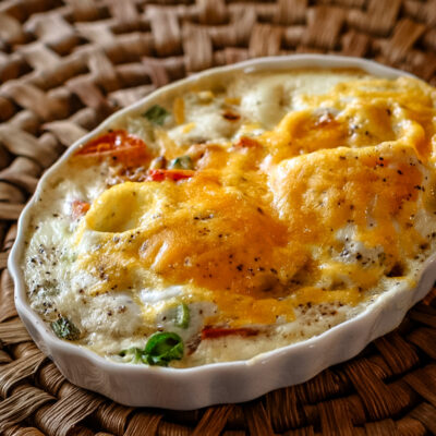 Shirred eggs with cheese in a ramekin