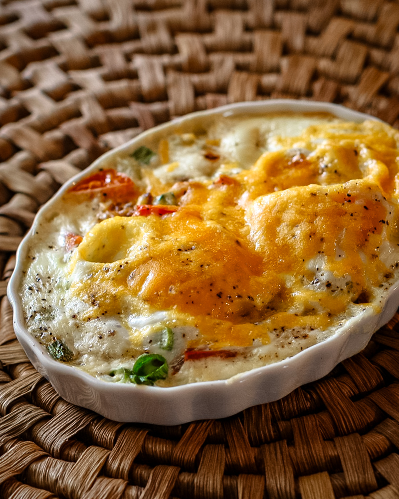 Shirred eggs with cheese in a ramekin