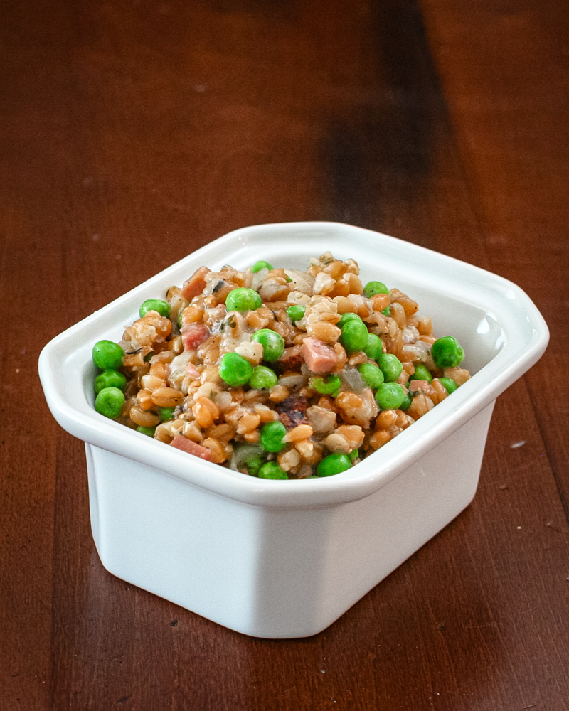 slow cooker farro pilaf in a serving dish