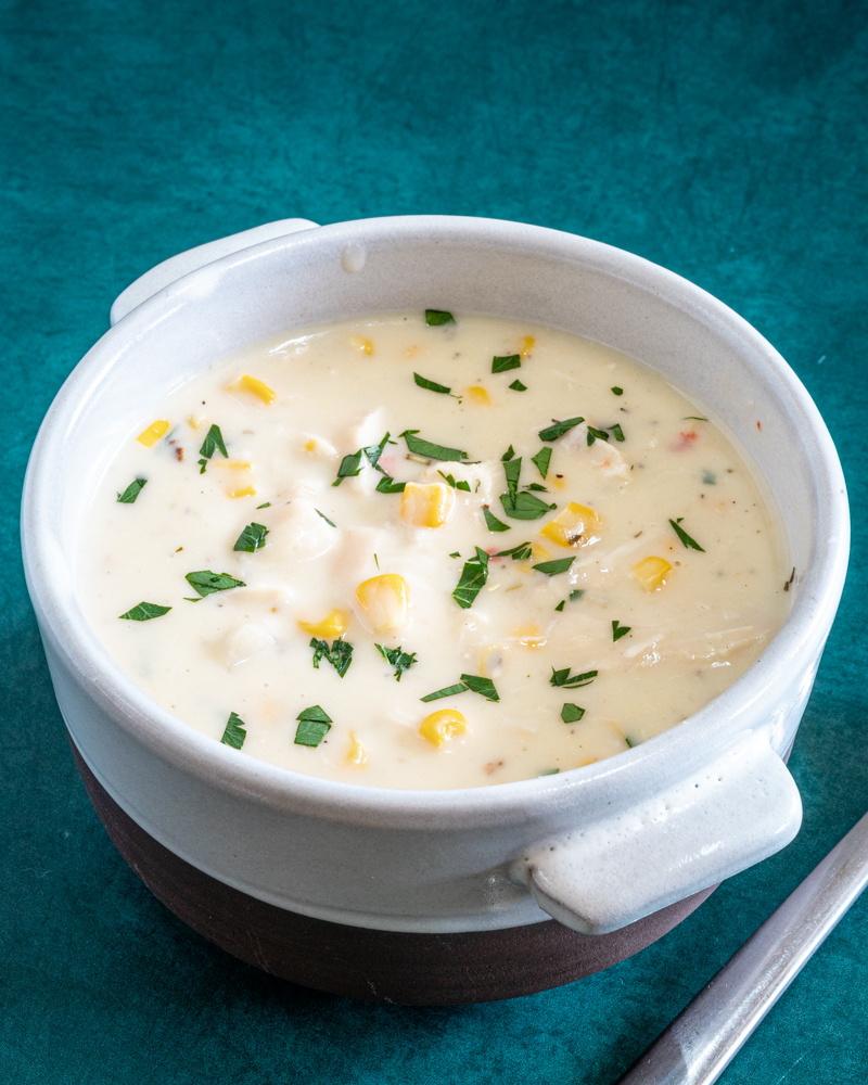 20 minute chicken chowder with corn and parsley garnish in a bowl