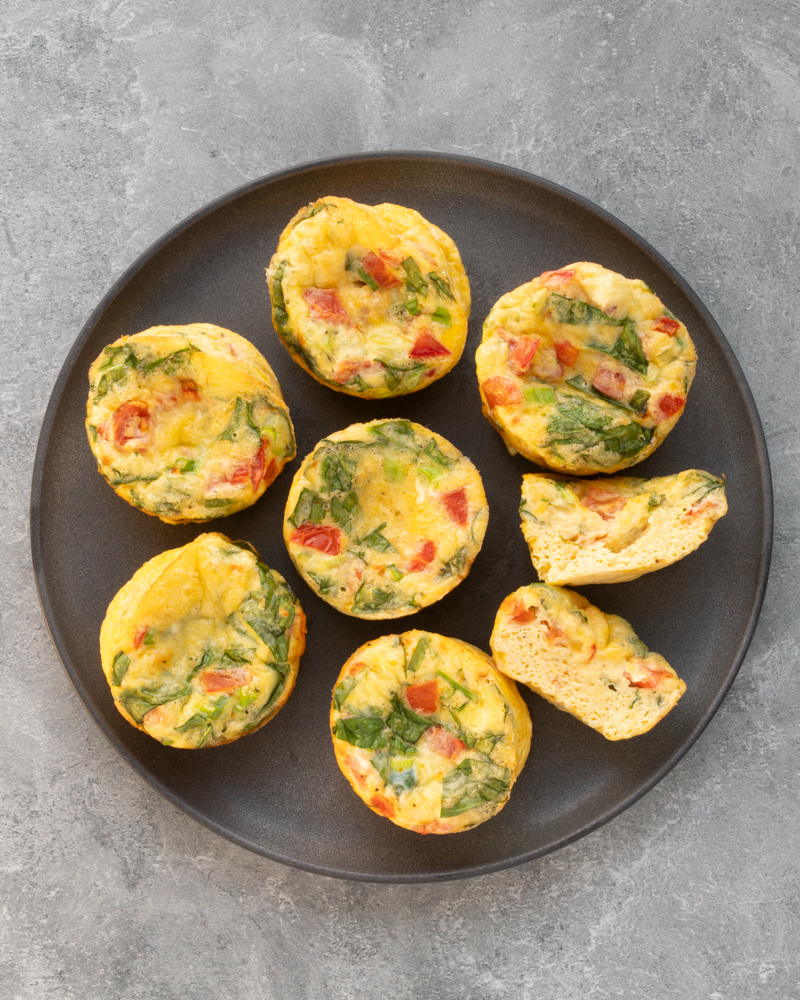 Adaptable egg bites on a dark gray serving plate