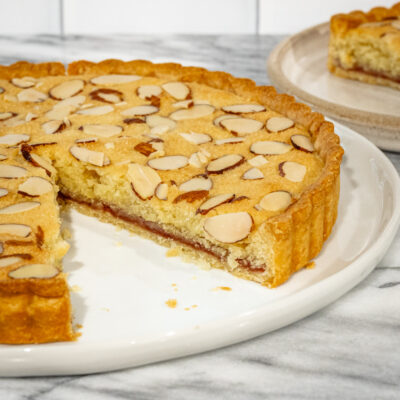 bakewell tart with a slice in the background