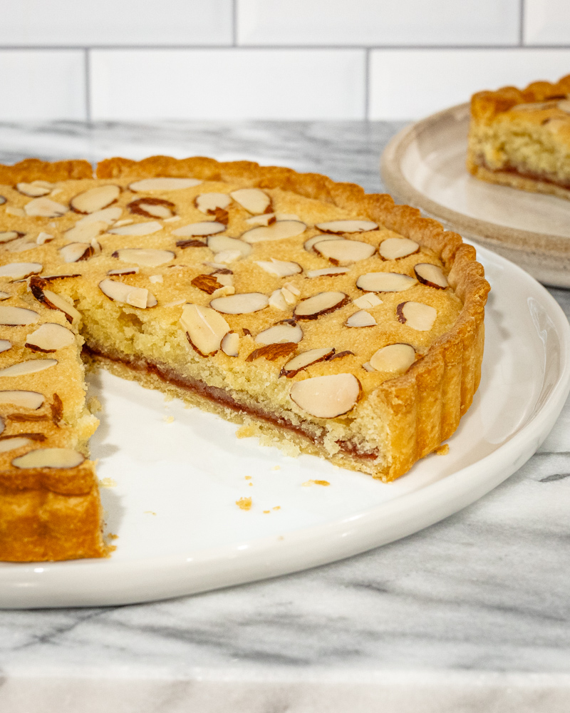bakewell tart with a slice in the background