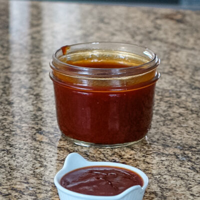 BBQ sauce with molasses shown in a 1/2-pint mason jar.
