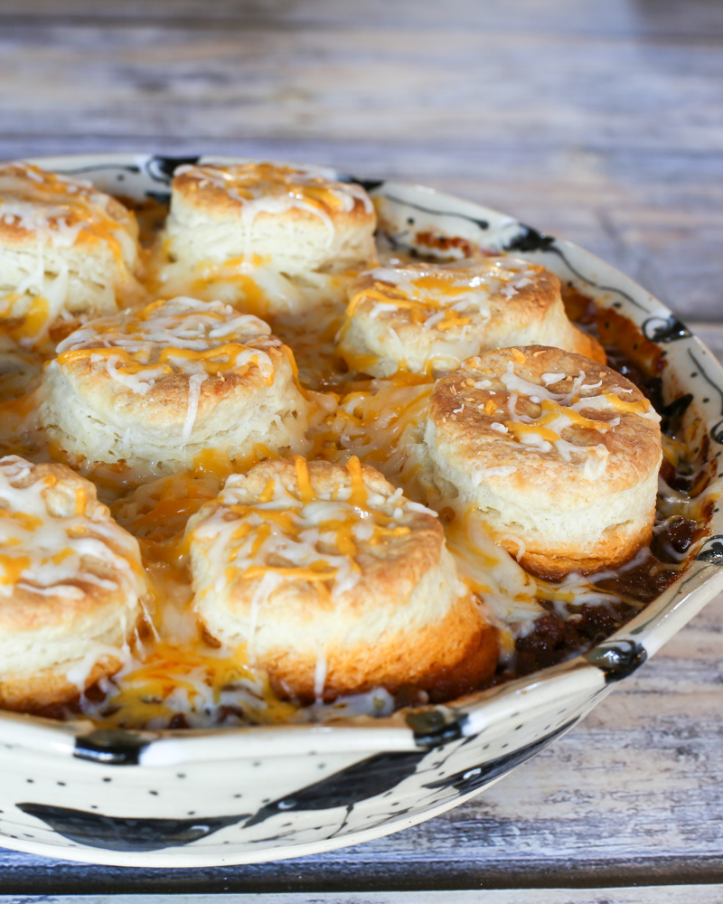 beef and bean casserole with biscuits and cheese topping