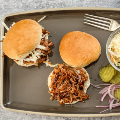 Shredded beer-braised pork on buns.