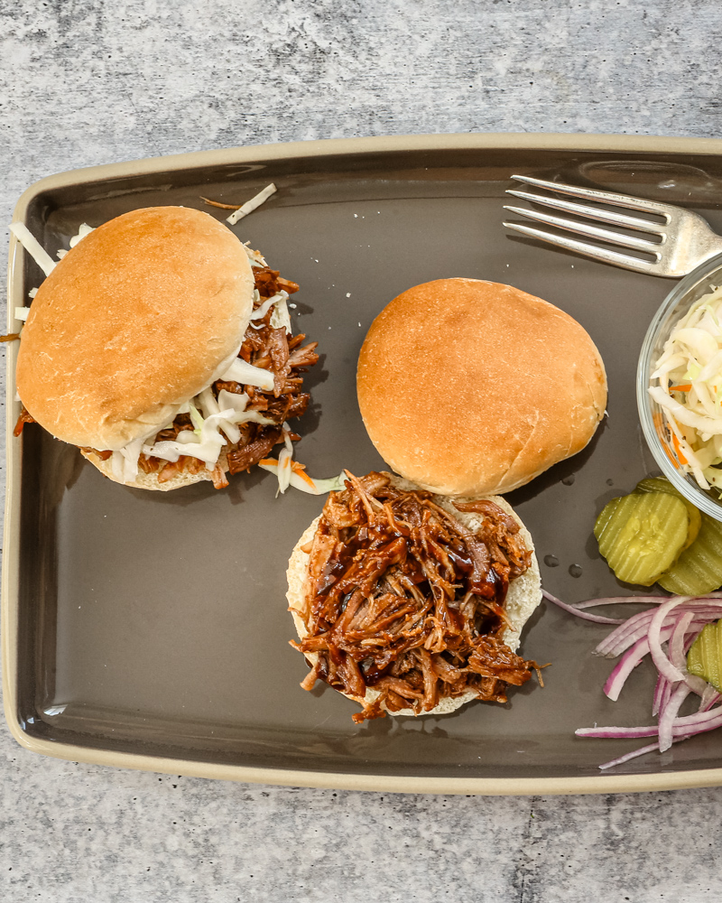 Shredded beer-braised pork on buns.