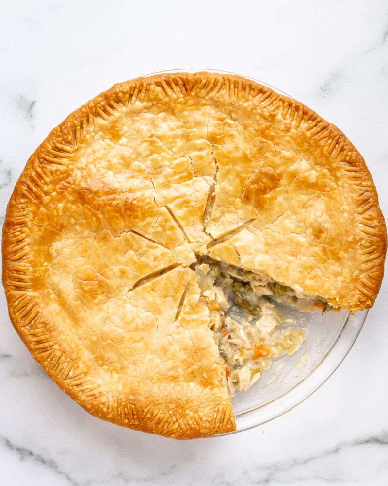 Chicken pot pie with 1 slice removed.