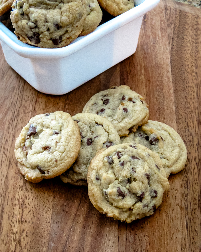 Best chocolate chip cookies on a cutting board.