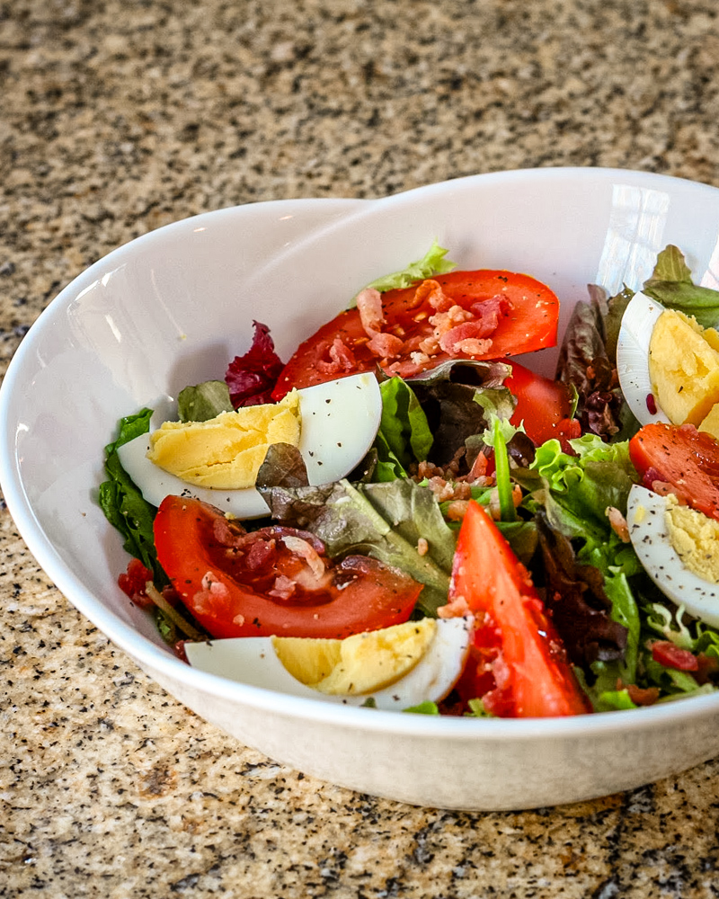 BLT salad in a white serving bowl.