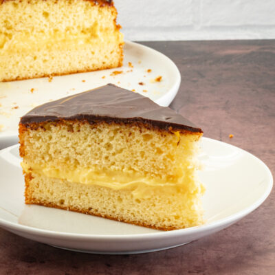 a slice of boston cream pie on a plate
