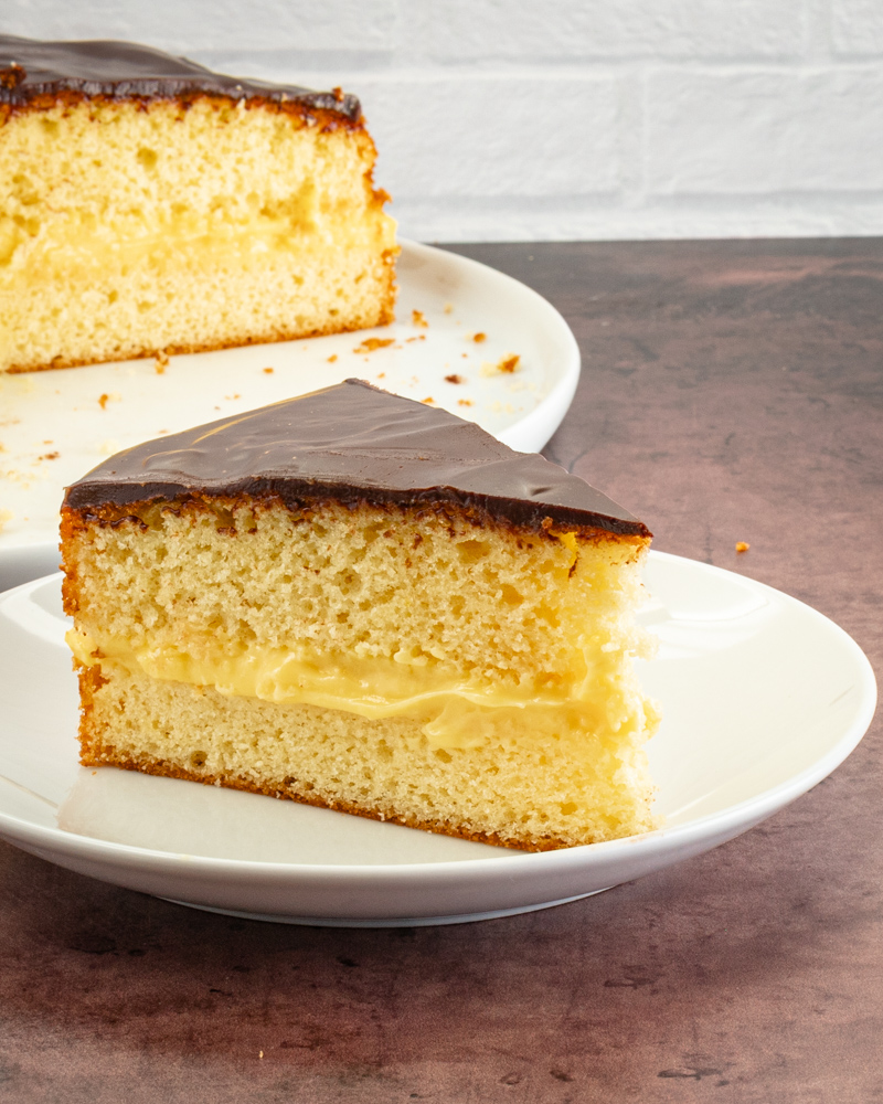a slice of boston cream pie on a plate