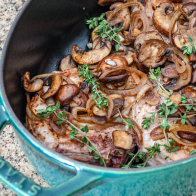 braised pork chops with mushrooms in a dutch oven