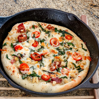 Pizza in an iron skillet, using a bread machine pizza dough.