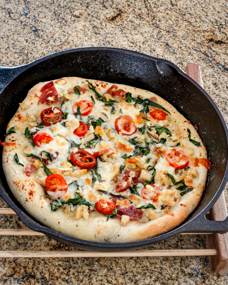 Pizza in an iron skillet, using a bread machine pizza dough.