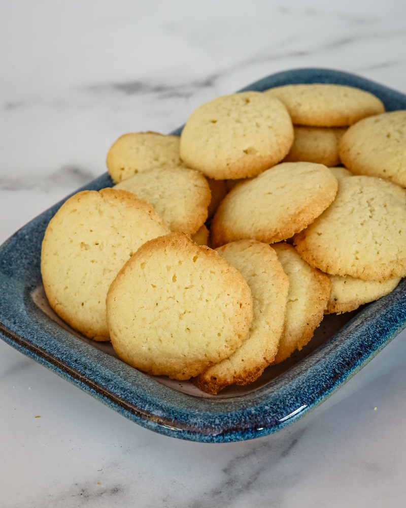 brown edge cookies on a small serving tray